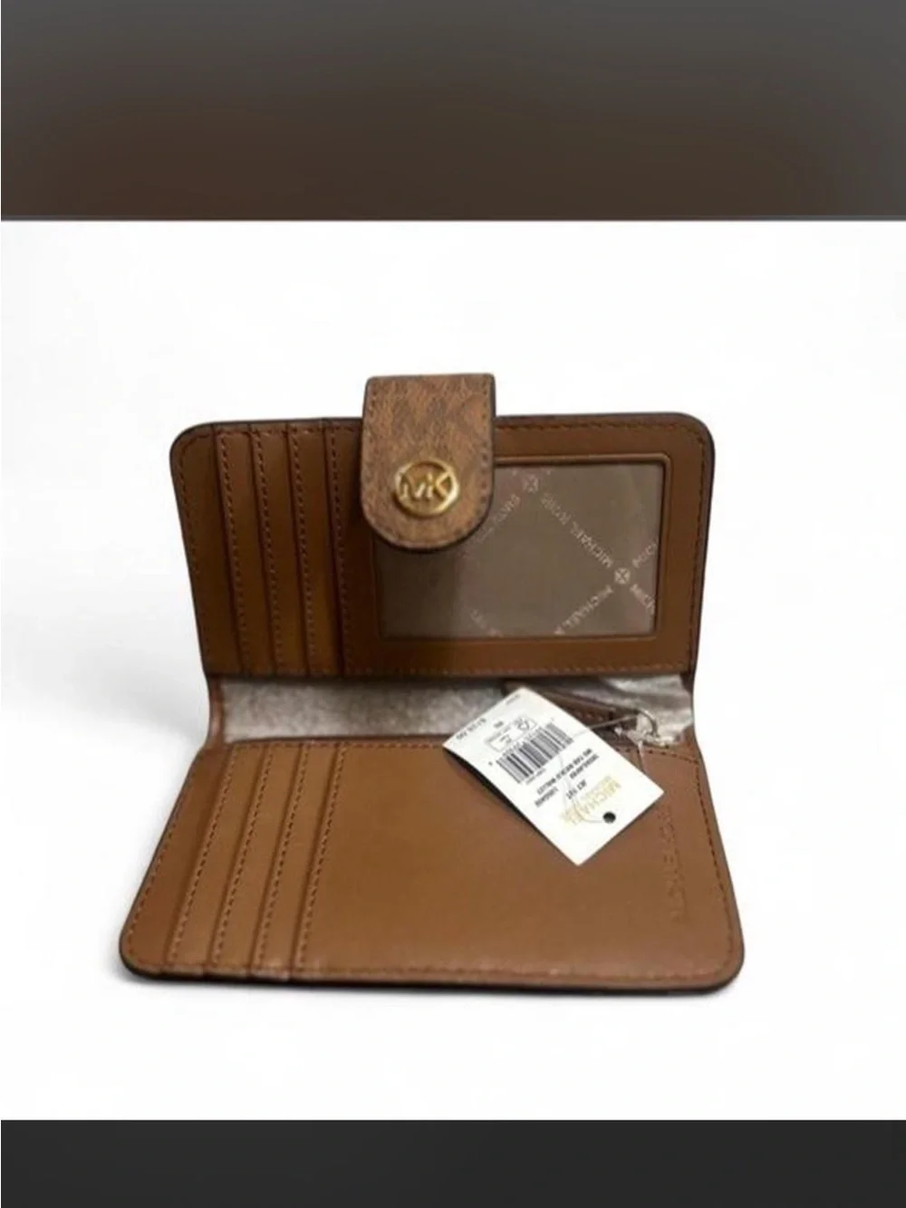 NWT Michael Kors medium tab bifold leather wallet.